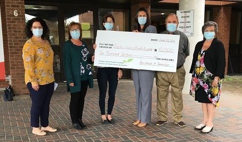 RYAM employees with donation cheque